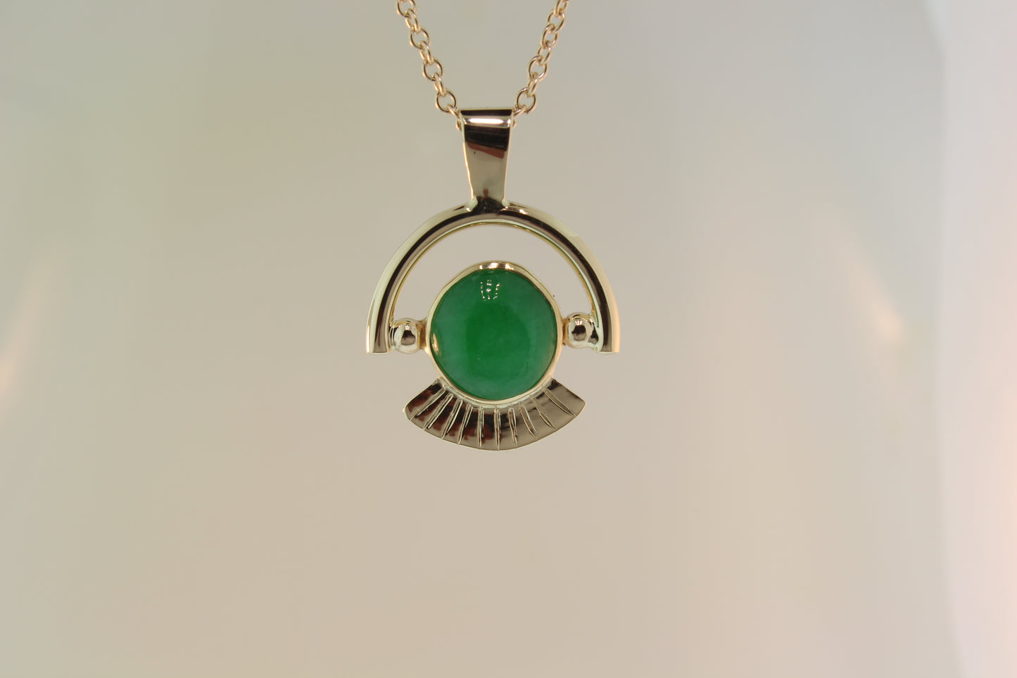 Jadeite set in yellow gold pendant